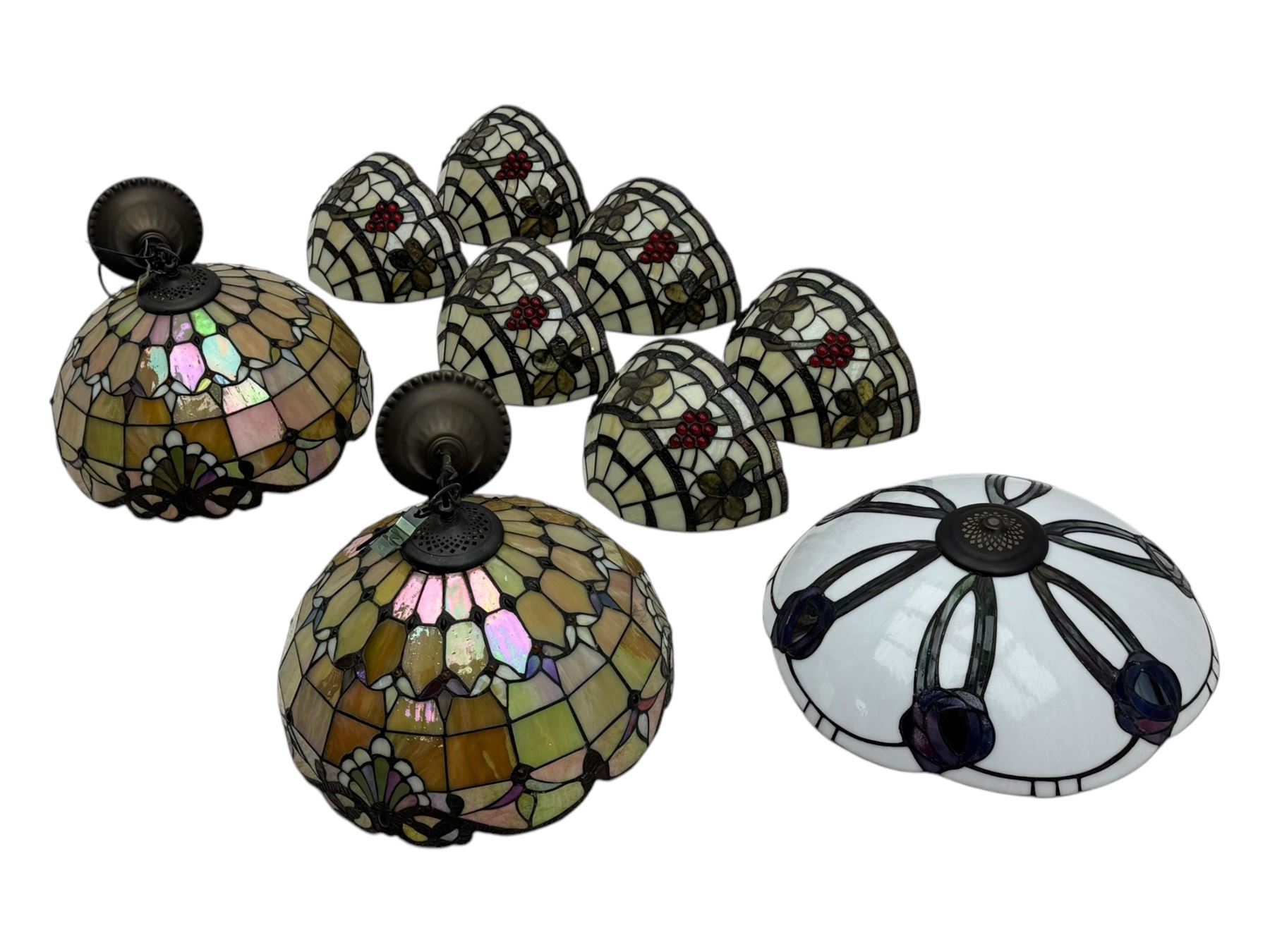 Collection of Tiffany-style light shades, to include six bowl-shaped wall-mounted fittings with floral and berry motifs and three ceiling-mounted light shades