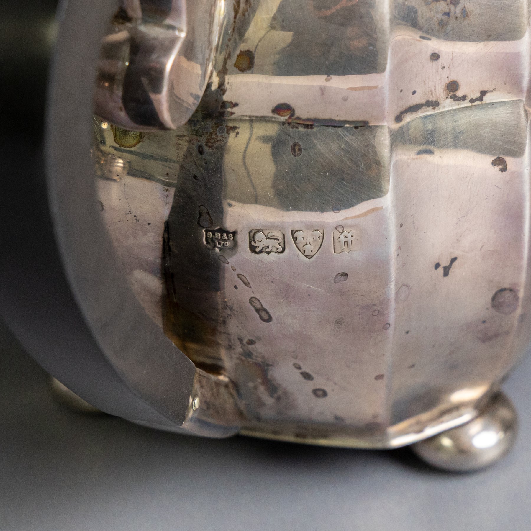 1930s silver three piece tea service, comprising teapot, milk jug and open sucrier, of oval form, the teapot with ebonised handle and finial, hallmarked S Blanckensee & Son Ltd, Chester 1931