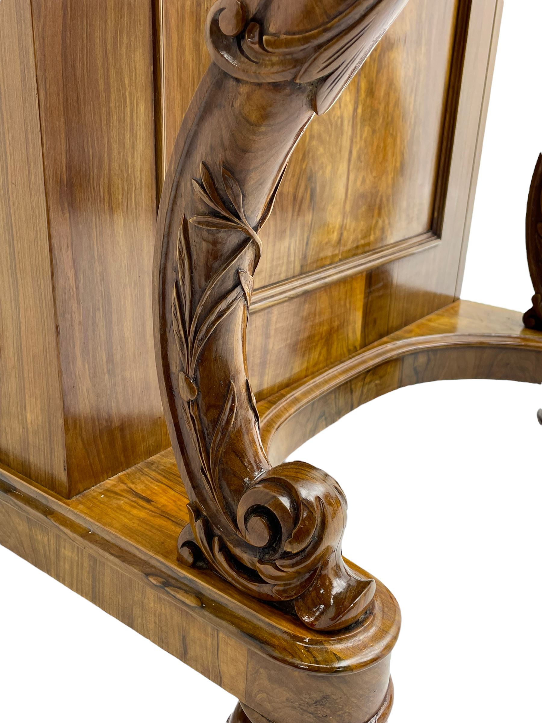 Fine and unusual 19th century olivewood piano top davenport, raised shaped back carved with olive branches and olives, the top hinges to reveal lidded and correspondence compartments, the piano lid enclosing sliding top with hinged and adjustable writing surface with leather inset, right-hand panelled door enclosing four drawers, olive branch and scroll carved cabriole front supports on moulded and shaped platform, turned cup feet with recessed castors 