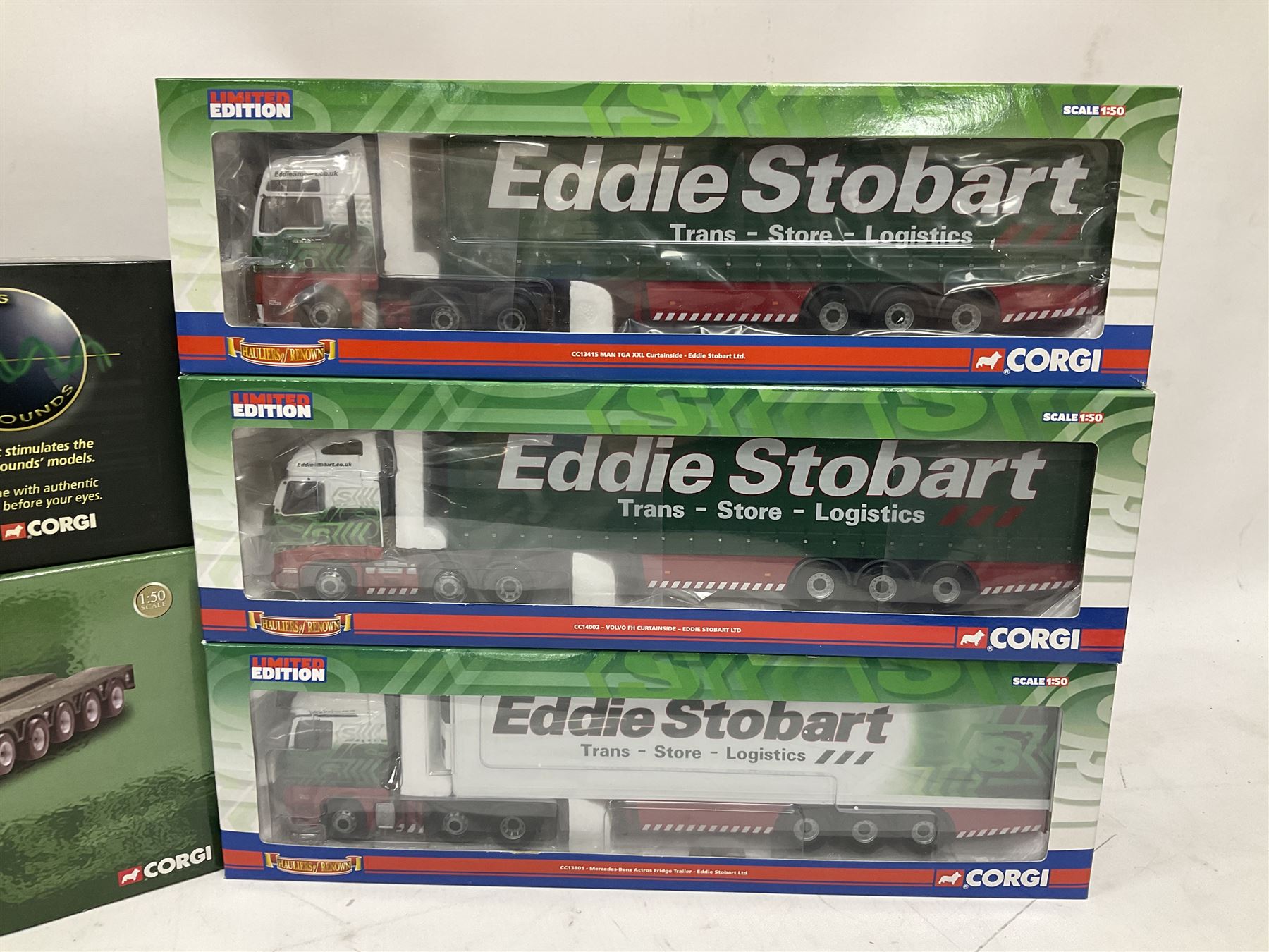 Corgi Eddie Stobart - five limited edition heavy haulage vehicles comprising CC12203 Scania Low Loader; CC12936 Scania Topline Curtainside Trailer; CC13801 Mercedes-Benz Actros Fridge Trailer; CC13415 MAN TGA XXL Curtainside; and CC14002 Volvo FH Curtainside; all boxed (5)