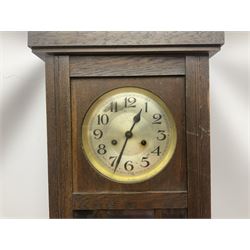A 1930s spring driven wall clock