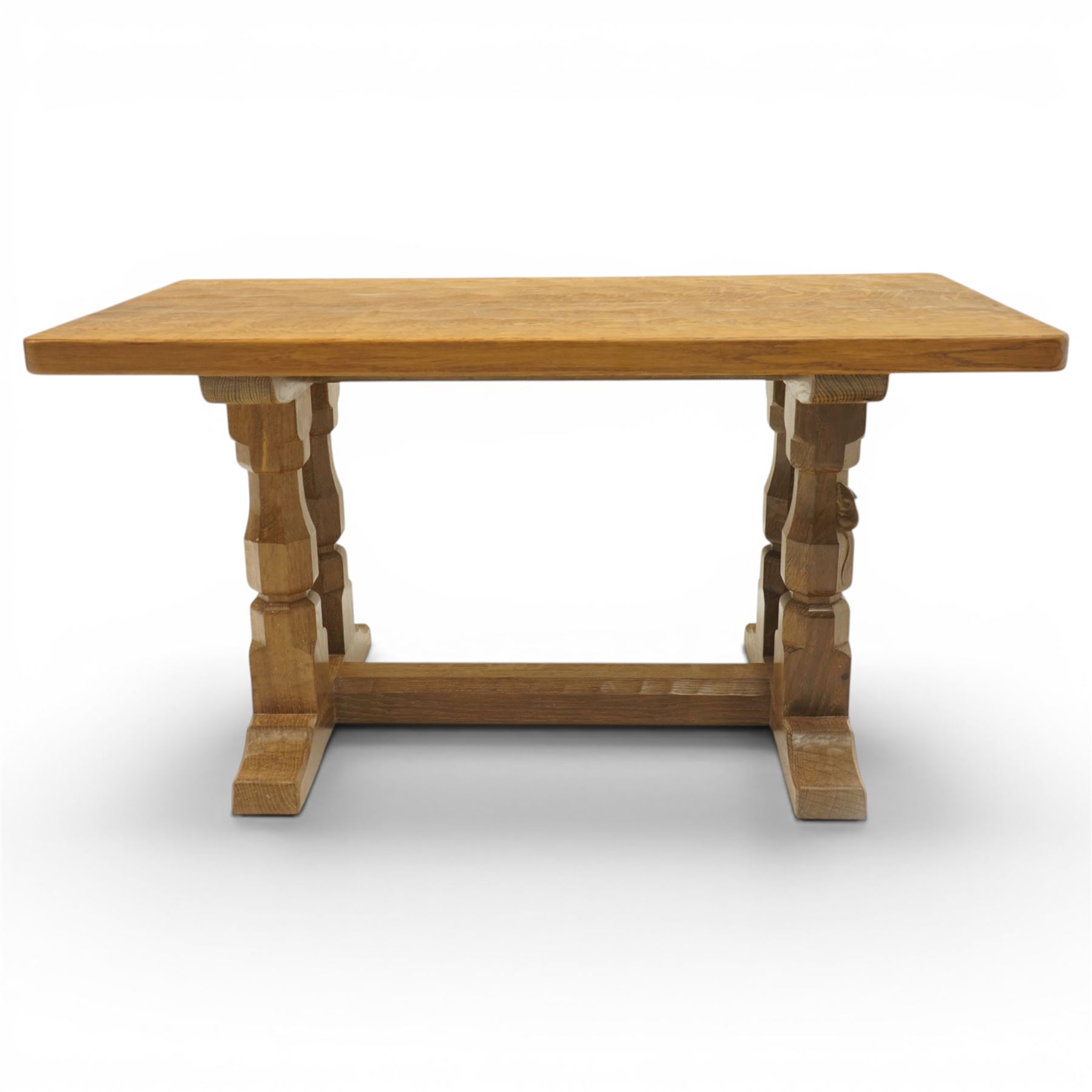 Mouseman - adzed oak rectangular coffee table, commissioned with four octagonal supports joined by chamfered stretcher terminating in sled feet, with carved mouse signature, by the workshop of Robert Thompson of Kilburn