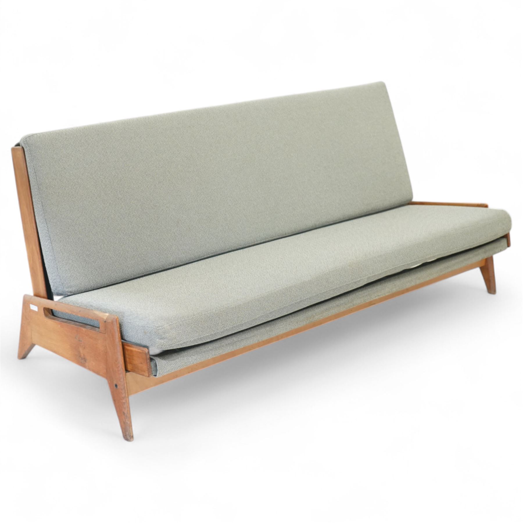 Gerard Guermonprez for Bobois - mid-century light teak sofa daybed, sides with angular teak wire sprung frame, integrated armrests with cut-out hand-holds, single fabric cushion back and seat, on out-swept tapered legs, circa 1955