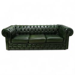 Late 20th century chesterfield style sofa upholstered in green leather, with deep buttoned back and arms above three loose cushions, continuous scroll arms and front, on concealed block feet