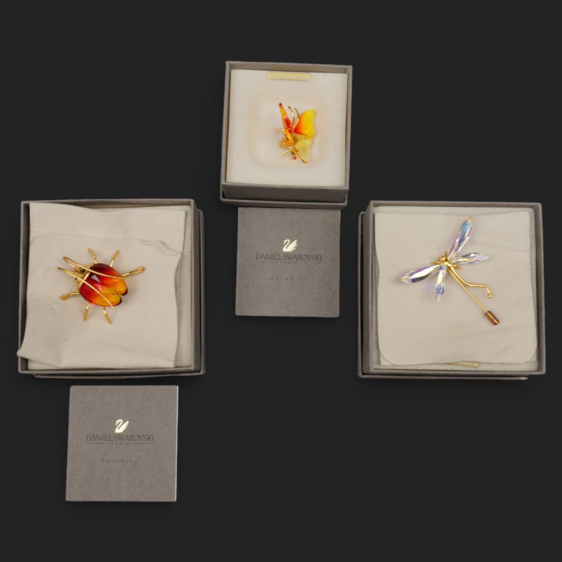 Swarovski crystal 'Alibey Dragonfly' pin, 'Amazar Beetle' brooch and 'Paradise Butterfly' magnetic brooch, boxed (3) 