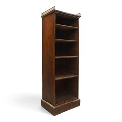 Victorian rosewood bookcase, pierced brass three quarter gallery, with four graduating shelves, raised on a plinth base 