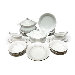 Chodziez Polish dinner wares decorated in white and gilt to include lidded twin handled tureens, bowls, plates etc