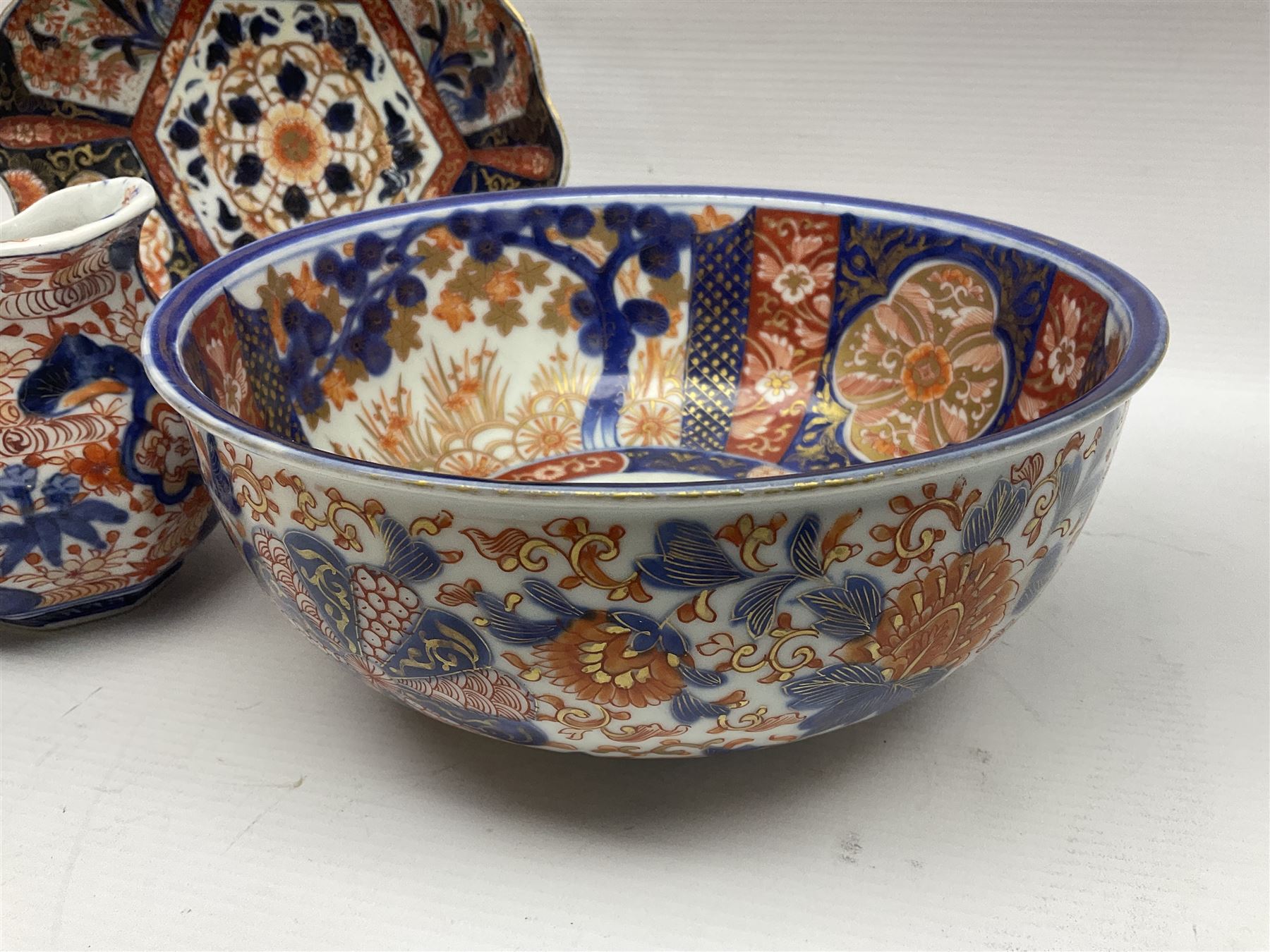 Two Japanese Imari bowls, together with Imari dish with scalloped edge and jug, largest bowl, H12cm
