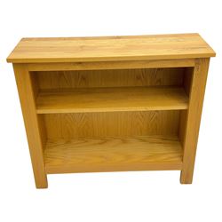 Five light wood open bookcases, four with two adjustable shelves, (W89cm, D29cm, H94cm), one with one adjustable shelf (W89cm, D29cm, H77cm)  