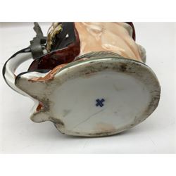 Otto Von Bismarck figural 0.5l stein, his black pickelhaube helmet with chrome spike serving as the lid, in green uniform and gilt detail throughout, pewter thumb hinge, with blue hash Musterschutz type mark, H18cm