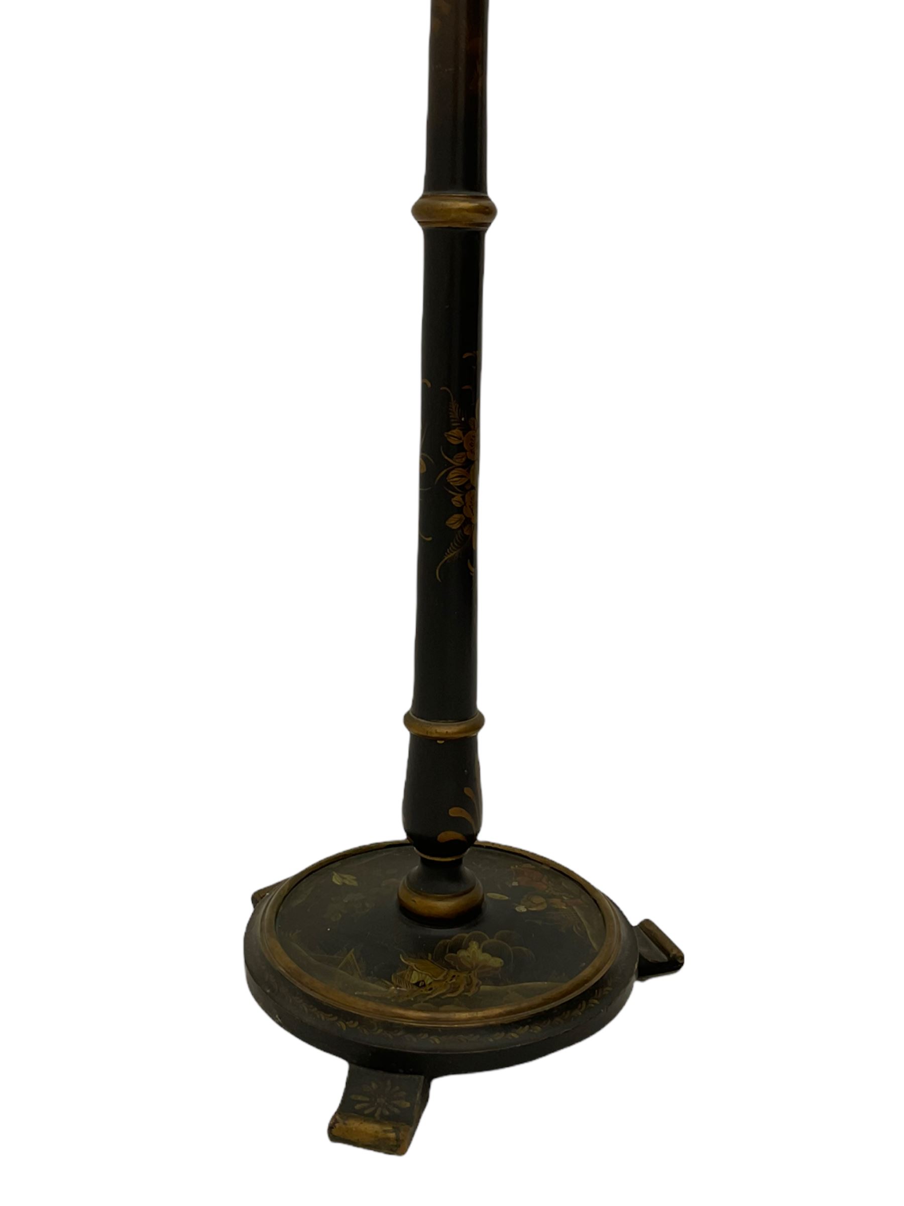 Late 20th century chinoiserie standard lamp, the circular base decorated with raised gilt figural scenes, H153cm (measurement excluding shade and fitting)