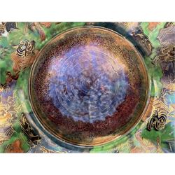 Early 20th century Wedgwood Fairland lustre bowl, circa 1920, of octagonal form, designed by Daisy Makeig-Jones, the exterior decorated in the Castle on the Road pattern, the interior decorated in the Fairy in a Cage pattern, pattern no Z5125, with printed marks beneath, H11cm D22.5cm
