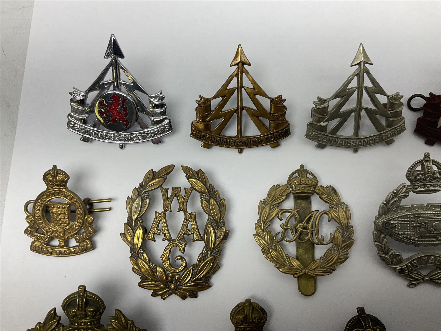 Twenty-seven military metal cap badges including Royal tank Corps, Reconnaissance Corps, Royal Armoured Corps, Royal Corps of Signals, Womens Army Auxiliary Corps, Queen Mary's Army Auxiliary Corps, Auxiliary Territorial Service,  Royal Engineers, REME, Army physical Training Corps etc 
