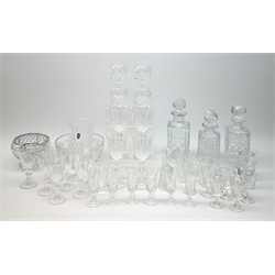 Collection of table glass comprising a set of four Thomas Webb hock glasses, Royal Doulton cut glass vase, three decanters and other glassware 