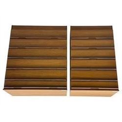 Avalon - two mid-20th century teak chests, with rectangular top above six graduated drawers, each fitted with recessed sculted pulls, raised on a flush plinth base.

(W 82cm D 55cm H 97cm)
(W 82cm D 55cm H 97cm)
