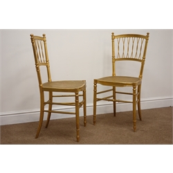  Pair late 19th century gilt wood bedroom chairs, interlaced splats and turned finials with caned seats on slender turned supports with stretchers, H84cm (2)  