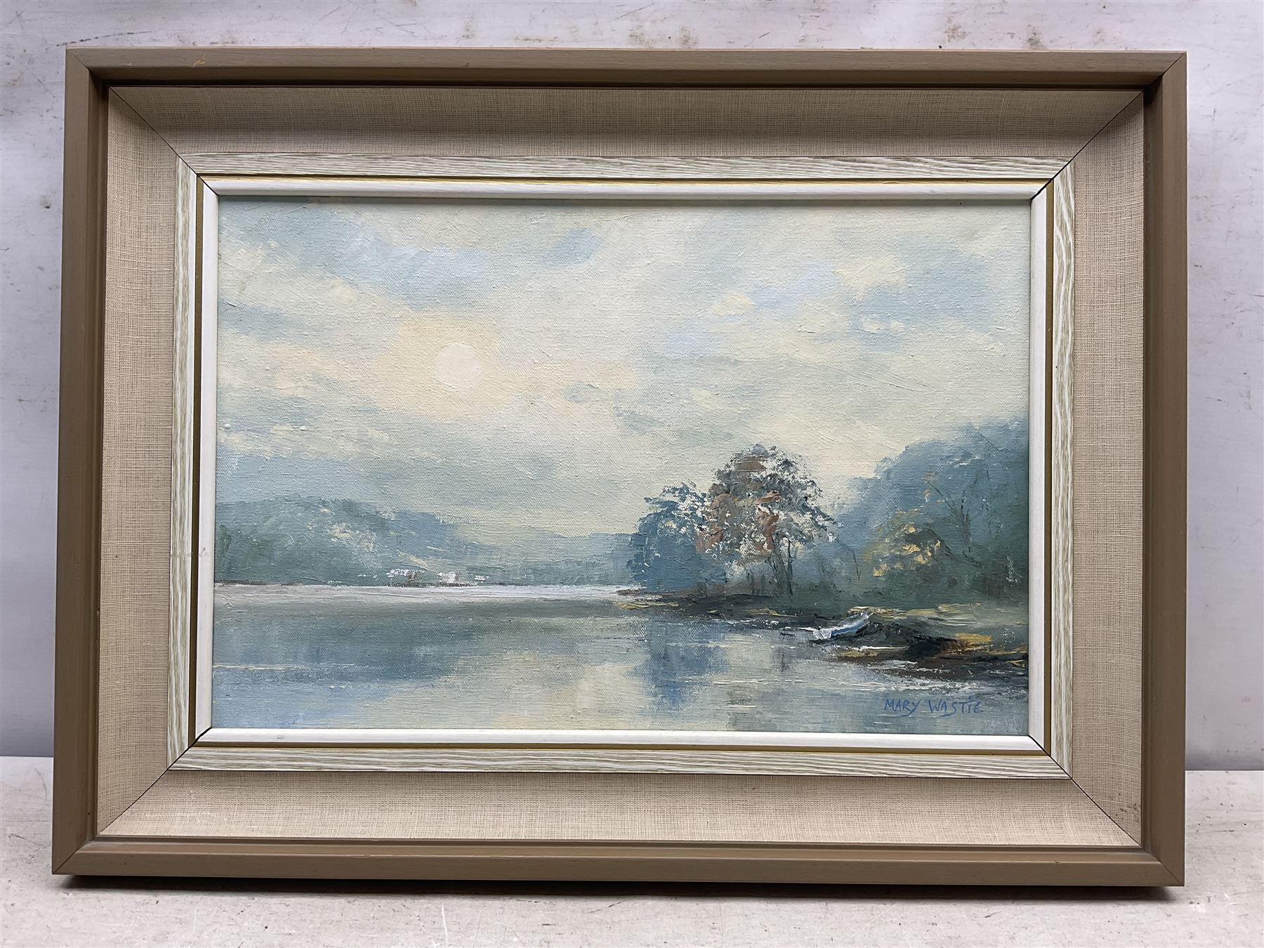 Mary Wastie (Cornish 1935-): Sunshine Over a Lake, oil on canvas signed 29cm x 44cm