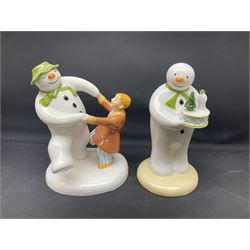 Four Coalport Characters The Snowman figures, comprising Snowman's Surprise, Christmas Cheer with certificate, The Bashful Blush and Dancing at the Party, all with original boxes 