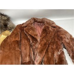 Three ladies fur coats, together with a large collection ladies stoles, including a black fox example