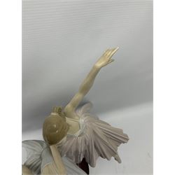 Lladro figure group, 'Merry Ballet', modelled as two ballerinas in dancing pose, raised on a turned socle base, no. 5035, printed marks beneath, H49cm