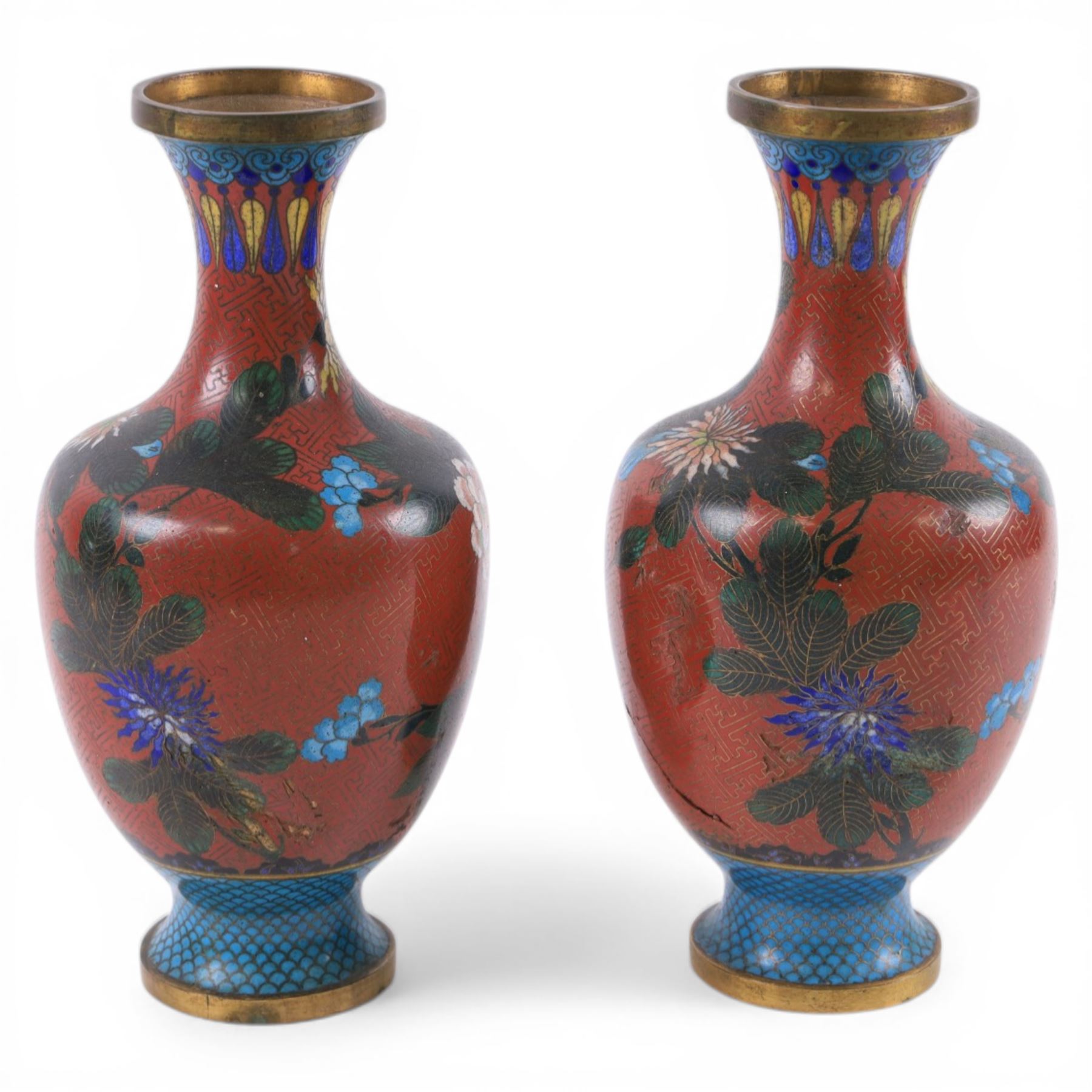 Pair of Chinese cloisonne vases, each of baluster form, decorated with blossoming peonies upon a red ground, H23.5cm