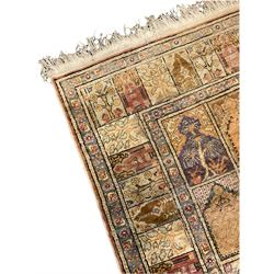 Turkish Keyseri beige ground rug, decorated with multiple panels each with plant motifs and stepped arch pediments, flower head band border 