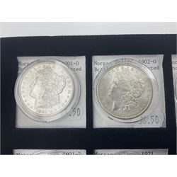 Seven United States of America silver Morgan dollar coins, dated 1884, 1901 O, 1902 O, 1903, 1904 O, 1921 D and 1921