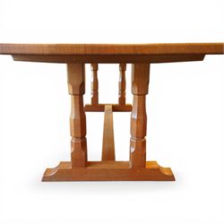 Knightman - oak rectangular refectory four pillar dining table, rectangular plank top, over twin pillar supports to both ends, united by a single stretcher with sled feet, with carved knight signature, by Horace Knight of Thirsk
