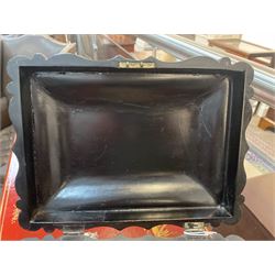 Victorian black lacquered papier-mâché sewing box, of rectangular form with shaped sides, the slightly domed top with inlaid mother of pearl and abalone decoration, the sides with gilt and polychrome painted scrollwork, the hinged cover opening to reveal a fitted interior with lift out tray, H14cm