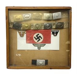 Display of eleven German belt buckles in