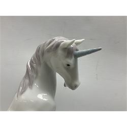 Lladro Privilege figure, Magical Unicorn, modelled as a unicorn with a raised front hoof, sculpted by Joan Coderch, with original box, no 7697, year issued 2002, year retired 2004, H22cm