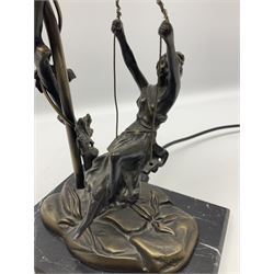 Art Nouveau style lamp in the form of a woman on a swing, with a green mottled shade, upon a marble base H52cm