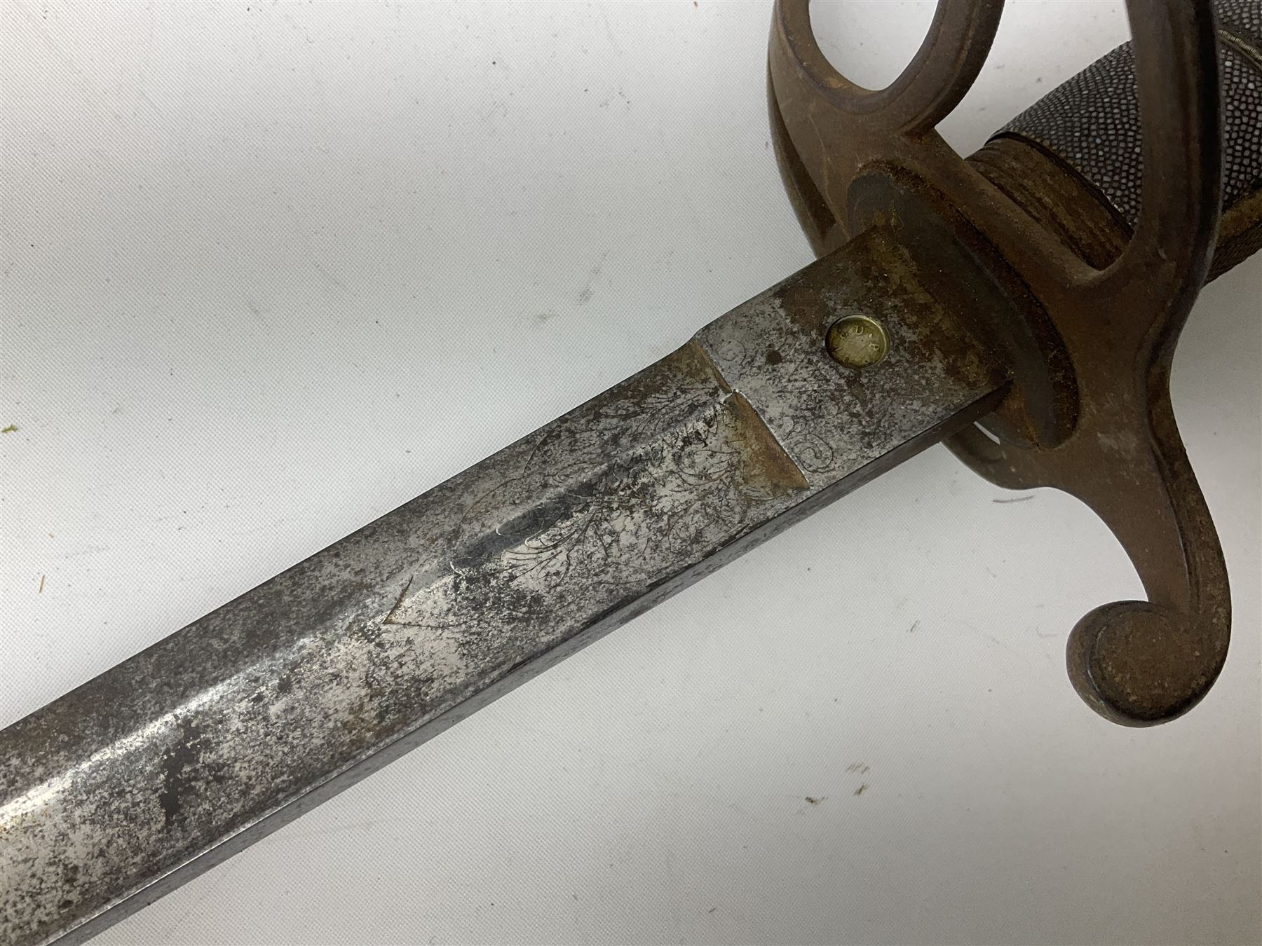 Victorian artillery officer's sword, the 90cm fullered steel blade by E. Thurkle Denmark Street Soho London decorated with Victoria cypher, Regimental crest and 'Royal Artillery', three-bar hilt with stepped pommel and wire-bound fish skin grip; in leather covered scabbard L107cm overall