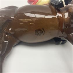 Beswick hunting group, comprising huntswoman on grey horse no 1730, huntsman on brown horse no 1501, fox figure no 1440 and eight fox hounds, all with printed marks beneath (11)