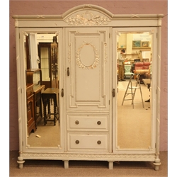  Early 20th century French style grey finish triple wardrobe, arched cornice and two mirror doors enclosing cupboard above two drawers, white moulded detail on turned supports, W205cm, H230cm, D67cm  