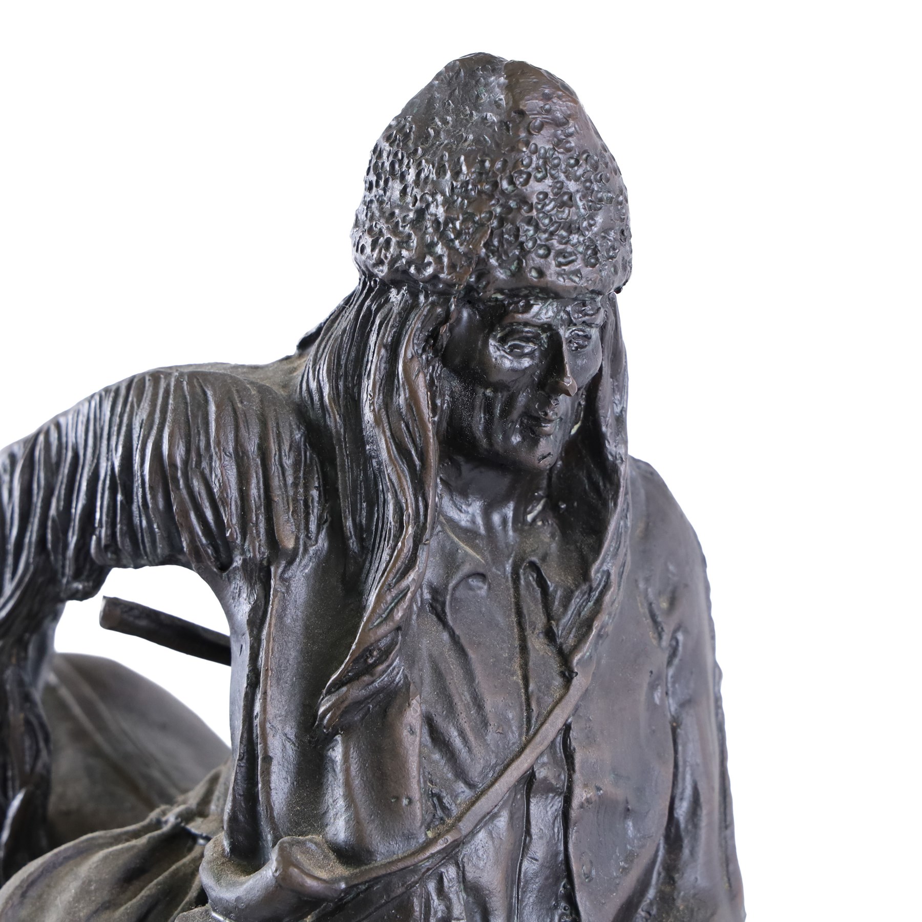 After Frederick Remington; The Mountain Man bronzed spelter figure of a native American trapper upon a marble base with plaque, H72cm