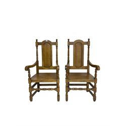 Pair William and Mary design oak armchairs, high back with turned uprights flanking central panel, scrolled arm terminals raised on turned supports united by stretchers