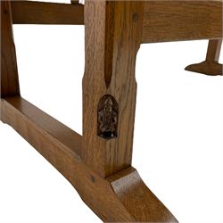Gnomeman - oak dining table, circular adzed drop-leaf top, square tapered and chamfered supports on sledge feet, carved with gnome signature, by Thomas Whittaker of Littlebeck