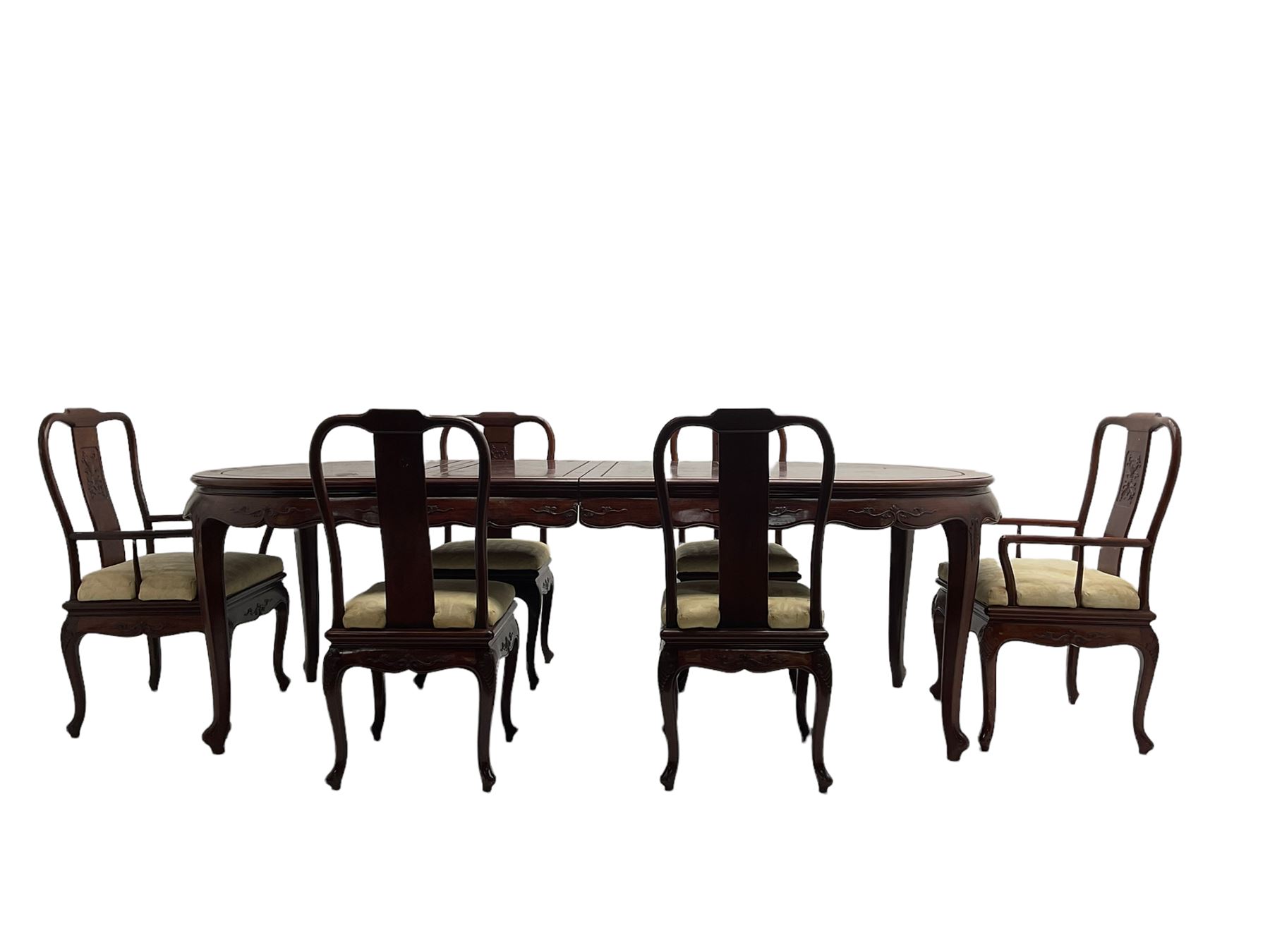 Mid to late 20th century Chinese hardwood extending dining table, two additional leaves, shaped apron carved with foliate scrolls, leaf carved cabriole supports (W246cm, H78cm, D117cm), and set six (4+2) dining chairs with shaped cresting rails over carved splats