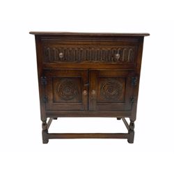 Reproduction carved oak cupboard, fitted with drawer and double cupboard 