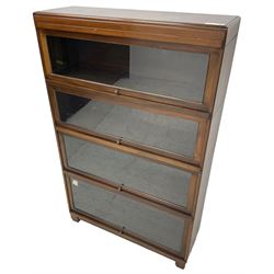 Globe Wernicke - early 20th century mahogany four-sectional stacking library bookcase, each shelf enclosed by glazed up-and-over doors, raised on square block feet
