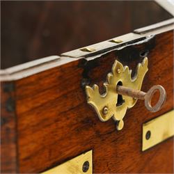 Late 18th century Anglo-Indian padouk and brass-bound octagonal cellarette or wine cooler, the hinged lid enclosing a vacant interior, the panelled body with applied brass strapwork, pierced escutcheon and side carrying handles, raised on a separate stand terminating to four fluted and reeded cabriole supports