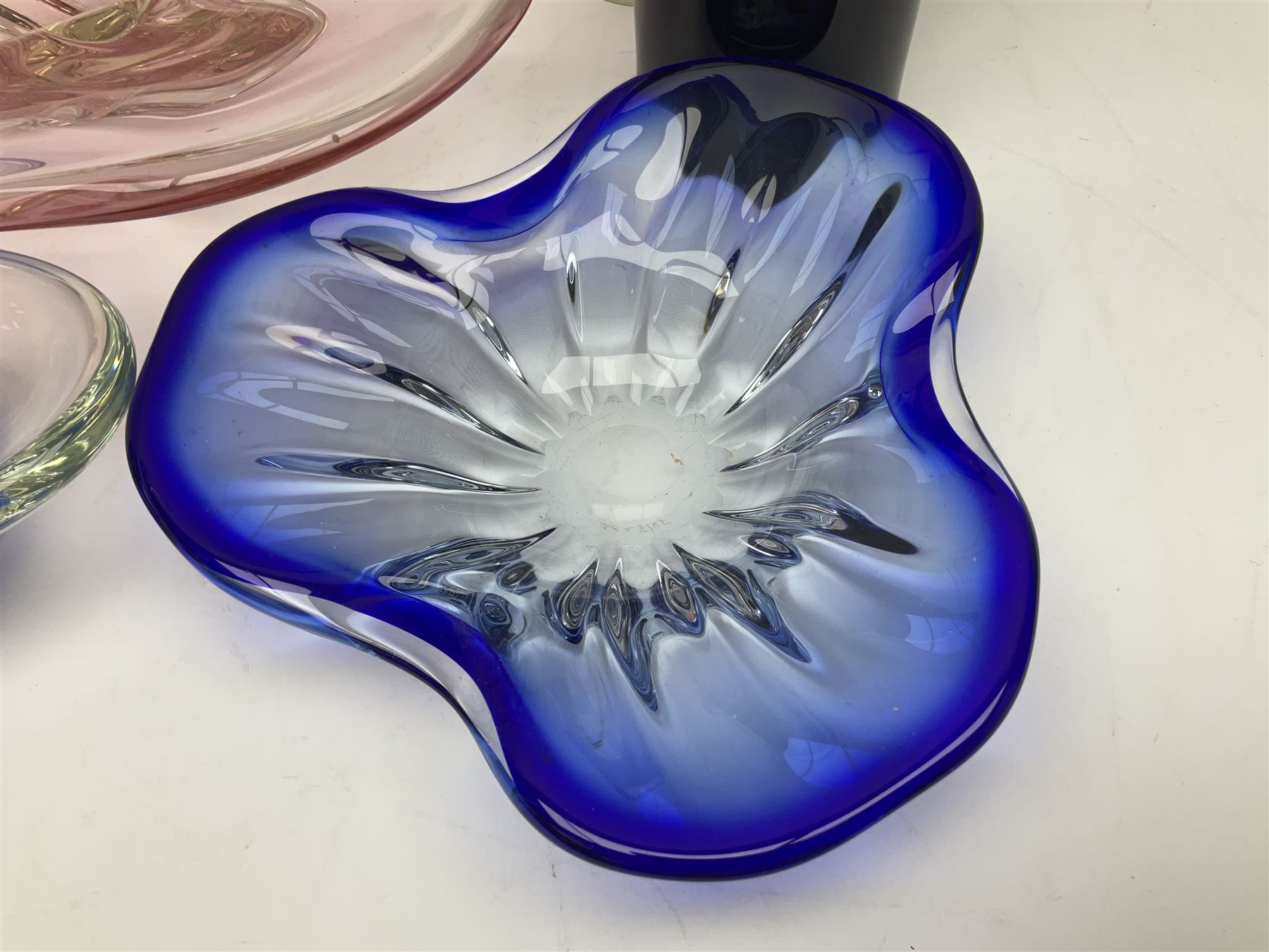 Two Whitefriars glass jugs, together with a Swedish Pukeberg art glass vase and three art glass bowls, including large pink example, some signed to base, tallest H30.5cm