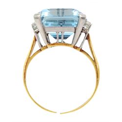 18ct gold single stone emerald cut aquamarine ring, with four channel set diamonds set either side, aquamarine approx 11.15 carat