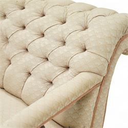 Late 19th century cream upholstered chaise longue, patterned pale damask fabric, padded arm with spindle back gallery raised on turned legs upon castors