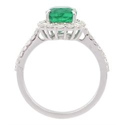 18ct white gold cushion cut emerald and round brilliant cut diamond cluster ring, with diamond set shoulders, stamped, emerald approx 2.30 carat