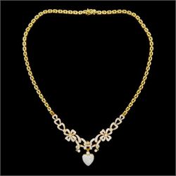 18ct gold diamond heart and bow necklace, the central panel set with round brilliant cut d...