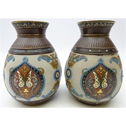  Pair Mettlach bulbous vases c1900, stylistically moulded with foliate scrolls, beaded borders with gilt highlights no. 1829, H18cm    