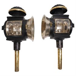 Pair of Edwardian black toleware and brass carriage lamps, the chimney over a rectangular ...