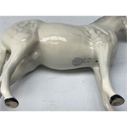 Collection of Beswick horses, including grey horse no.701, palomino foal no 836, grey stocky jogging mare no.855 etc, together two Royal Doulton horses, (8)